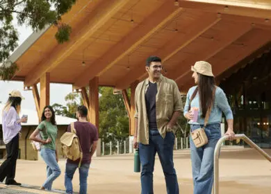 International students interacting and walking past Boola Katitjin building at Murdoch University, Murdoch
